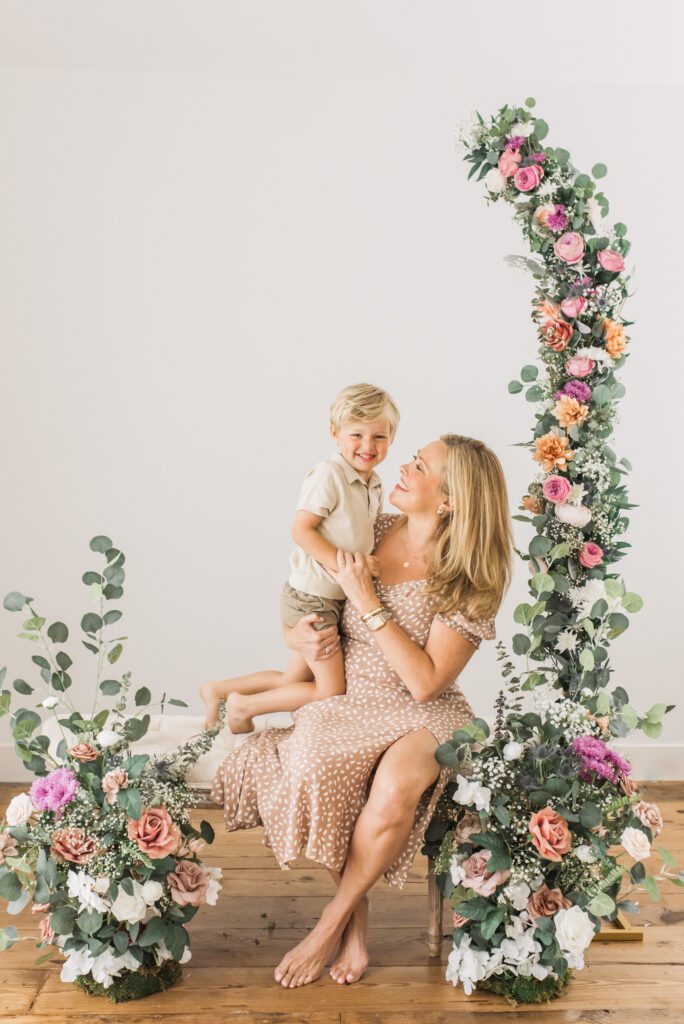 candid motherhood portrait of mom laughing with child in Friendswood, TX photography studio